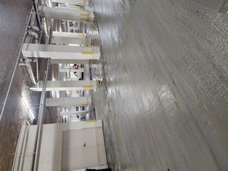 Parking garage after pressure washing — clean result Sarasota FL