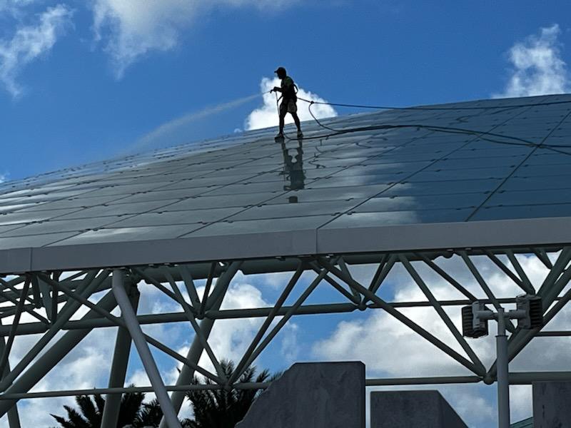 Overview of Mold Munchers crew cleaning Sarasota National Cemetery glass amphitheater