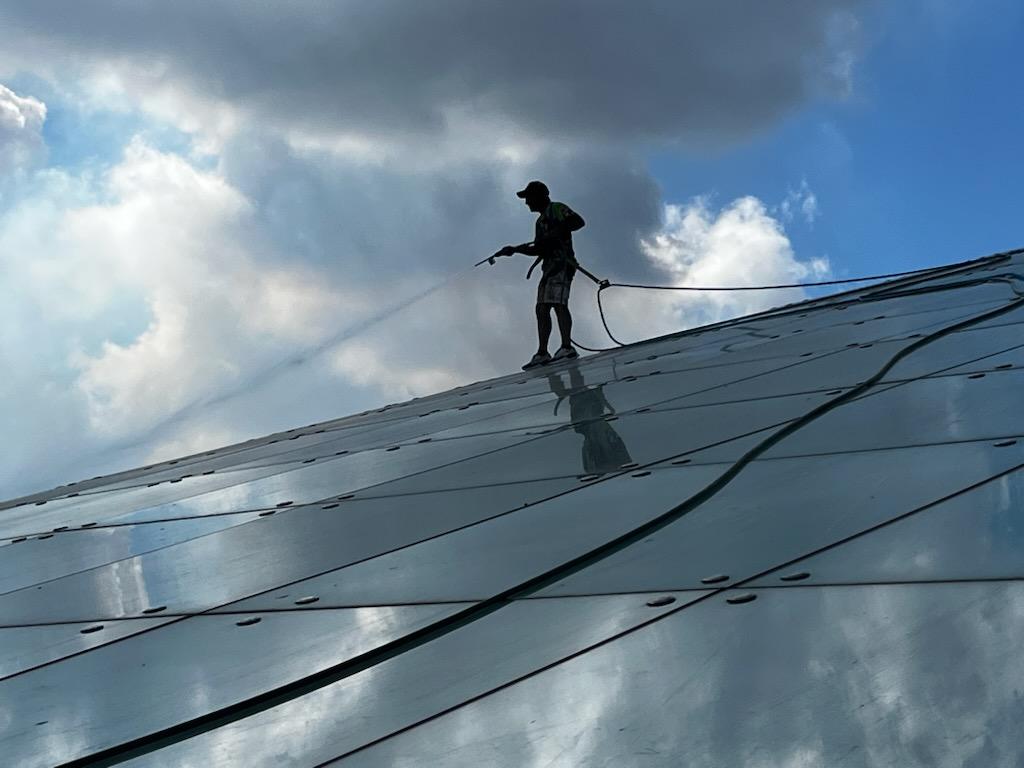 Silhouette of technician on glass amphitheater roof at Sarasota National Cemetery